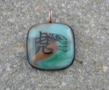 Fused Glass Pendant - Green and orange streaky glass with the Tiger Chinese Zodiac