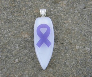 Fused Glass Pendant - White Iridized Shield with Purple Ribbon representing pancreatic cancer awareness.